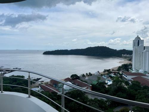 a view of the ocean from a balcony at 14F Luxury Resort Lifestyle Ocean Views in Playa Bonita Village