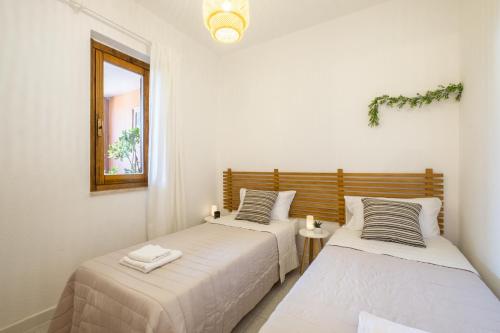 Ένα ή περισσότερα κρεβάτια σε δωμάτιο στο Casa A'MARI [3 Min. from the Beach - Free Parking]