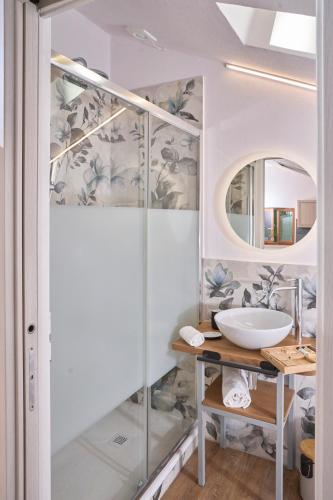 a bathroom with a sink and a mirror at La Baita - Monte Amiata - in Castel del Piano