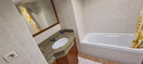 a bathroom with a sink and a bath tub at Luxury Hotel Apartment at Grand Plaza, San Stefano ,32floors-mega mall-3 basements in Alexandria