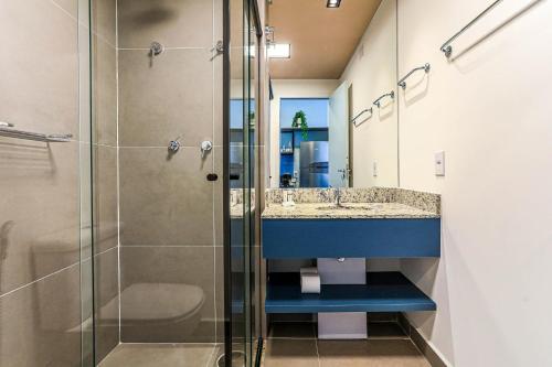 a bathroom with a shower and a sink at 360 RBS Elíseos in Sao Paulo