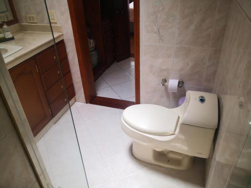 a bathroom with a toilet and a sink at Casa Pabón in Bogotá