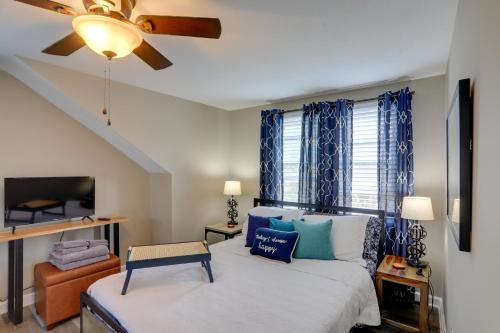 a bedroom with a bed and a ceiling fan at Welcoming Willoughby Home 1 Mi to Historic Dtwn in Willoughby