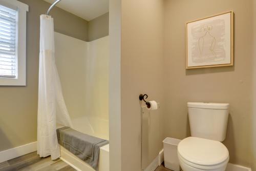 a bathroom with a toilet and a shower at Welcoming Willoughby Home 1 Mi to Historic Dtwn in Willoughby