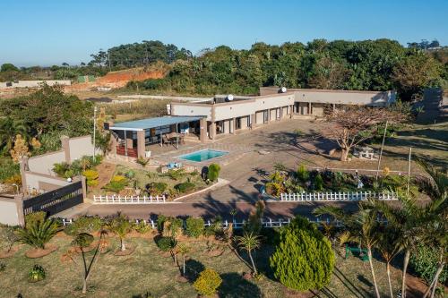 an aerial view of a building with a pool at Sada Boutique Hotel in Port Edward