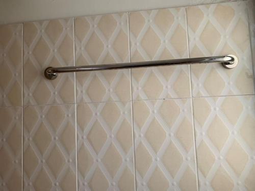 a towel rack on a wall in a shower at One Bedroom Cozy Apartment- KNUST & free Parking in Kumasi