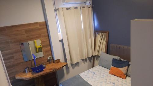 Ένα ή περισσότερα κρεβάτια σε δωμάτιο στο Guest House Lagoa