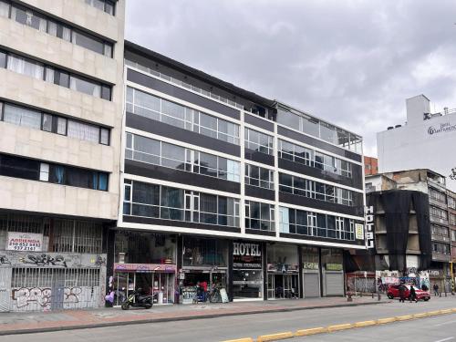a large building on a city street with a street at Hotel HILLS BOGOTA in Bogotá