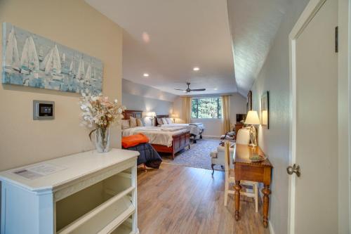 a bedroom with a bed and a living room at Cascade Cabin Hideaway with Views, half Mi to Lake in Cascade