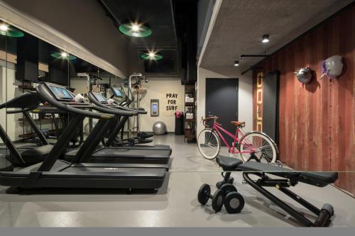 a gym with several treadmills and a bike at Moxy San Diego Gaslamp Quarter in San Diego