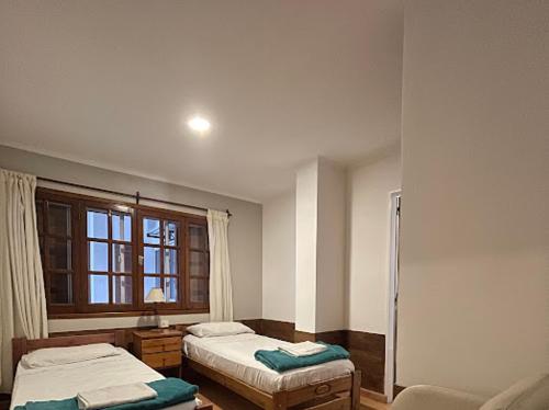 Un pat sau paturi într-o cameră la Hotel Pintó Terraza