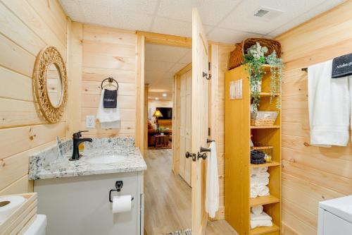 a bathroom with a sink and a mirror at Secluded Murphy Vacation Rental with Private Hot Tub in Murphy