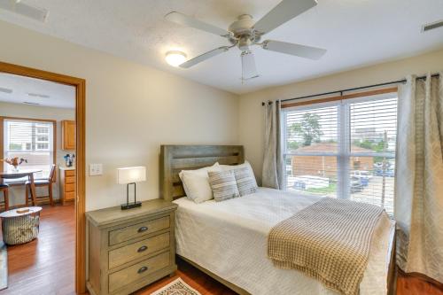 a bedroom with a bed with a ceiling fan and a window at Morgantown Apartment Near Hospitals 1 Mi to WVU! in Morgantown