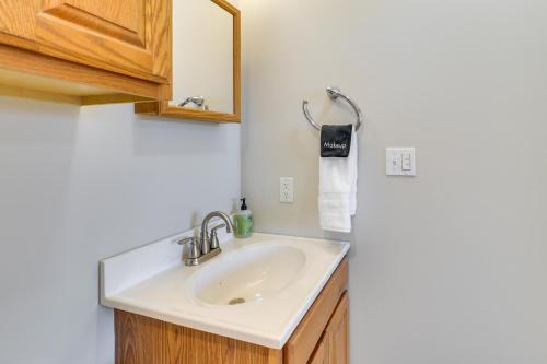 a bathroom with a sink and a mirror at Morgantown Apartment Near Hospitals 1 Mi to WVU! in Morgantown