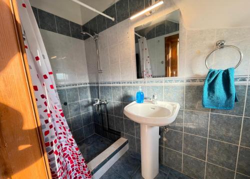 a bathroom with a sink and a shower at Sunset Pearl Holiday Villa in Ayia Napa