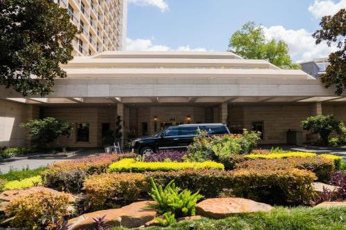 a car parked in front of a building at The St. Regis Houston in Houston