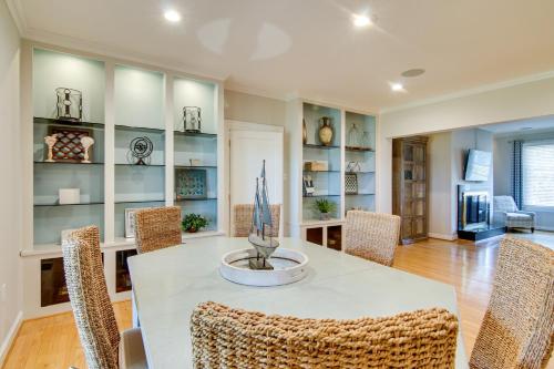 a dining room with a table and chairs at Waterfront Cambridge Gem with Hot Tub, Pool and Dock! in Woolford