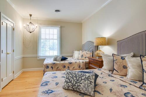 a bedroom with two beds and a window at Waterfront Cambridge Gem with Hot Tub, Pool and Dock! in Woolford