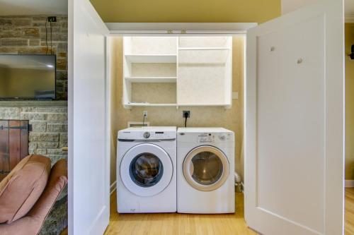 a laundry room with a washer and dryer at Waterfront Cambridge Gem with Hot Tub, Pool and Dock! in Woolford