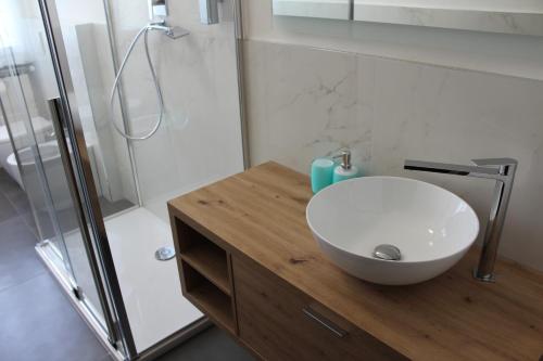 a bathroom with a white sink and a shower at Casa Vanessa in Arezzo