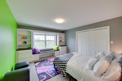 a bedroom with a large white bed and a window at Game Room and Covered Patio Hummelstown Hideaway in Hummelstown