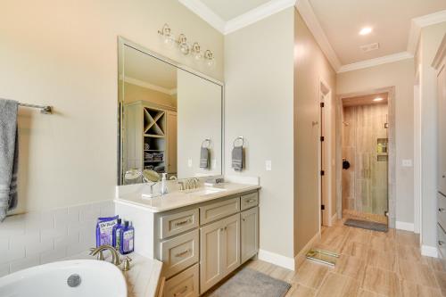 a bathroom with a sink and a mirror at WFH-Friendly Amarillo Home with Furnished Patio! in Amarillo