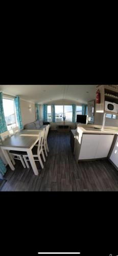 a kitchen and a living room on a boat at 87 kyntyre view Craig tara in Ayr