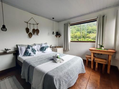 Postel nebo postele na pokoji v ubytování Suites casa do indio jungle, a melhor vista da floresta
