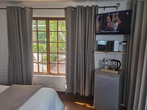 Ένα ή περισσότερα κρεβάτια σε δωμάτιο στο Libra Lodge & Spa - Randburg, Johannesburg
