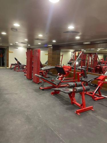 a row of red chairs in a gym at شقق البستان للشقق المخدومة in Al Hofuf