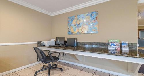 a office with a desk and a chair in a room at Best Western Roseville Inn in Roseville