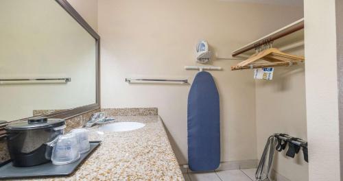 a bathroom with a sink and a mirror at Best Western Roseville Inn in Roseville