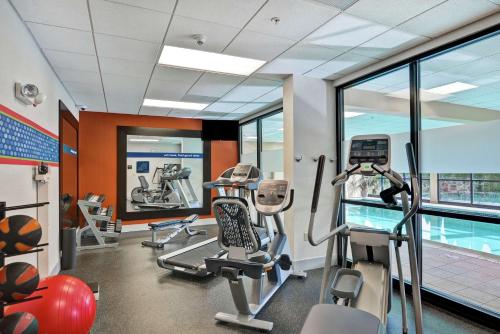a gym with cardio equipment and a swimming pool at Hampton Inn Lewisburg in Lewisburg