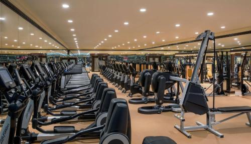 a gym with rows of treadmills and machines at Jeddah Hilton in Jeddah