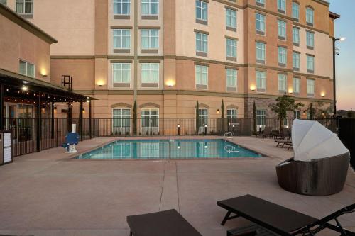 a swimming pool in front of a building at Homewood Suites By Hilton Santa Clarita/Valencia, Ca in Santa Clarita
