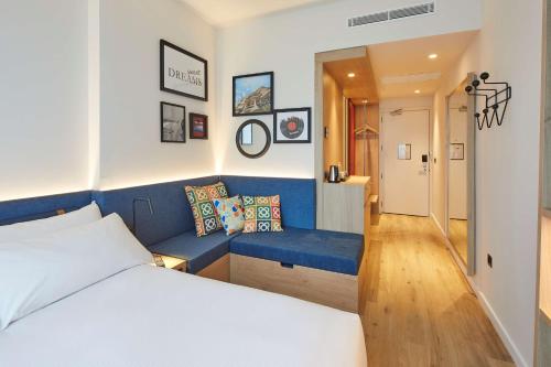 Un ou plusieurs lits dans un hébergement de l'établissement Hampton By Hilton Barcelona Fira Gran Via