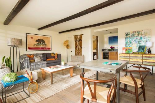 a living room with a table and chairs at The Leta Santa Barbara Goleta, Tapestry Collection by Hilton in Santa Barbara