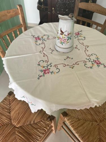 a table with a table cloth on top of a table at The Priest's Traditional House Kalithies in Kalithies