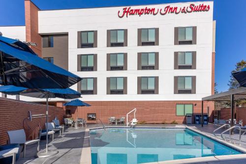 a hotel with a swimming pool in front of a building at Hampton Inn & Suites Santa Rosa Sonoma Wine Country in Santa Rosa