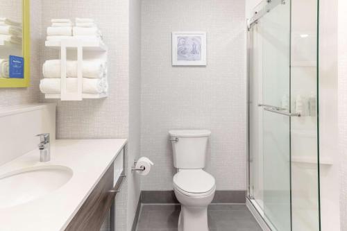 a bathroom with a toilet and a sink and a shower at Hampton Inn & Suites Santa Rosa Sonoma Wine Country in Santa Rosa