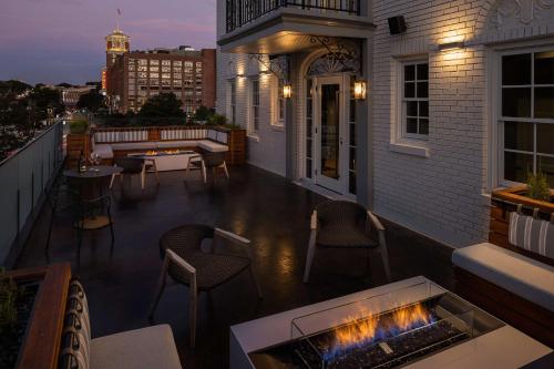 a balcony with a fire pit on a building at Wylie Hotel Atlanta, Tapestry Collection by Hilton in Atlanta
