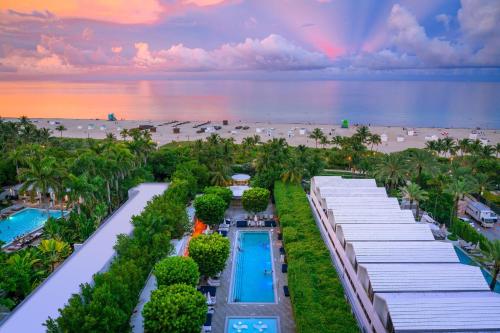 an aerial view of a resort with a beach at Nautilus Sonesta Miami Beach in Miami Beach