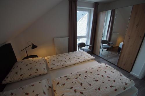 En eller flere senge i et værelse på Linda