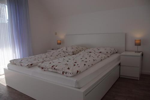 En eller flere senge i et værelse på Lisbeth