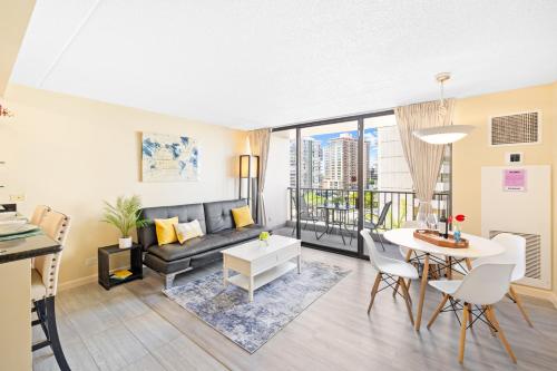 a living room with a couch and a table at Diamond Head View Close to Waikiki Beach with Parking in Honolulu