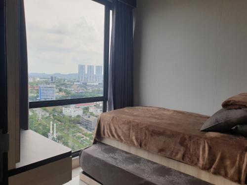 a bedroom with a bed and a large window at CozyHomes at One Residence Batam in Batam Center