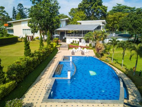 an aerial view of a house with a swimming pool at D'Agape Meeting & Conference in Puncak