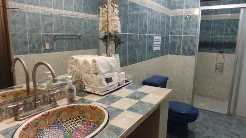 a bathroom with a sink and a counter top at Villas Paradise in San Francisco