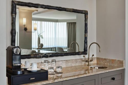 a bathroom with a sink and a mirror at The Whitley, a Luxury Collection Hotel, Atlanta Buckhead in Atlanta