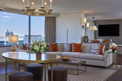 a living room with a couch and a table at The Whitley, a Luxury Collection Hotel, Atlanta Buckhead in Atlanta